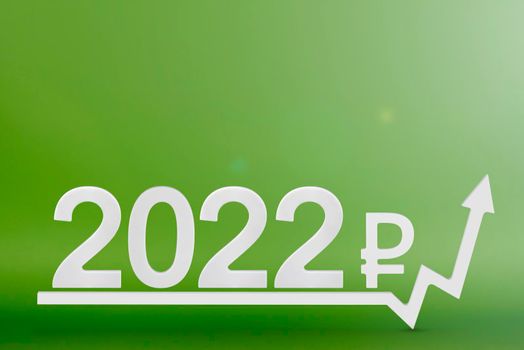 Real estate value in 2022. Rising costs of construction, insurance, rent and mortgages. inflation and rising prices. Numbers 2022 and ruble sign on up arrow, green background