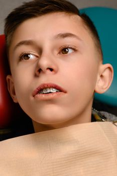regular visit to the orthodontist of the patient with braces, braces on the upper teeth.