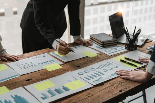 Business team working with new startup project plan and discussion for financial strategy with laptop and digital tablet in a modern business office.