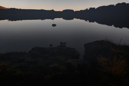 Reflection of Mount Turku in the reservoir of Lake Nesamovyto, Lake Nesamovyte and Mount Turkul, autumn landscapes of the Carpathians, morning in the mountains.