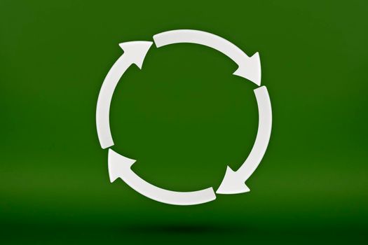 Ecology, recycling symbol, white arrows form a circle. 3D image on a green background. Green products, green renewable energy, graph pointing up and down.