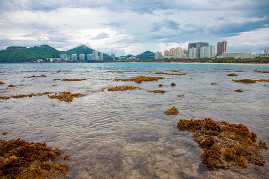 Dadonghai beach rock water view