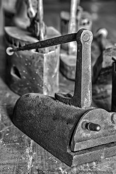 Ancient vintage irons for the clothes ironing. Black and white