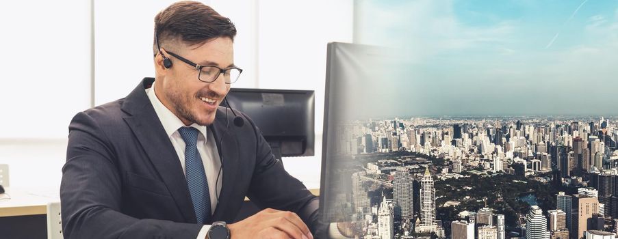 Business people wearing headset working in office to support remote customer or colleague. Call center, telemarketing, customer support agent provide service in broaden view .