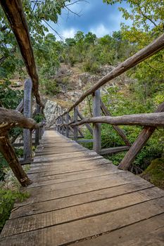 Beautiful wooden hand-made bridge in the Ecopath White River, near Kalofer, Bulgaria. Nature preservation while giving people access is the goal.