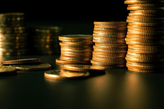 Pile of gold coins stack in finance treasury deposit bank account for saving . Concept of corporate business economy and financial growth by investment in valuable asset to gain cash revenue profit .