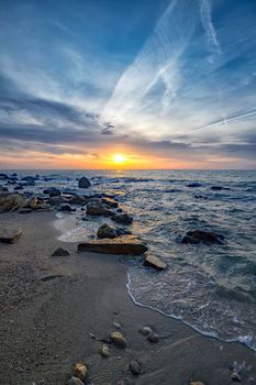 Superb sea landscape with colorful sunset or sunrise. Vertical view