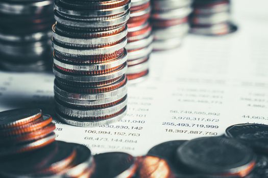 Pile of gold coins stack in finance treasury deposit bank account for saving . Concept of corporate business economy and financial growth by investment in valuable asset to gain cash revenue profit .