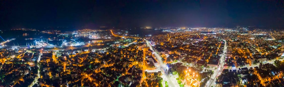 Beauty illuminated at night, a panoramic aerial view to streets in Varna, Bulgaria. Top view
