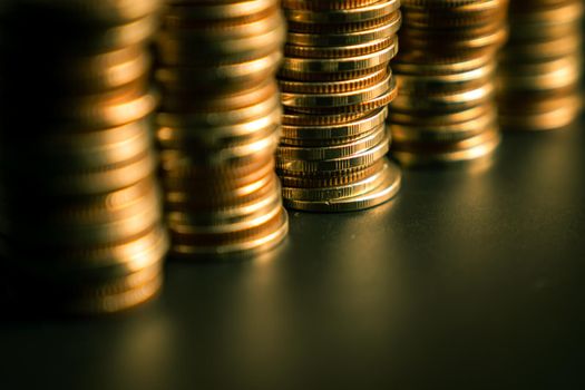 Pile of gold coins stack in finance treasury deposit bank account for saving . Concept of corporate business economy and financial growth by investment in valuable asset to gain cash revenue profit .