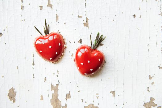 Beautiful and tasty dessert in the form of heart on an old wooden background, close-up. valentine card