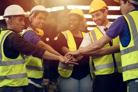 Engineer Teamwork Concept,Worker team join hands together in factory. People joining for cooperation success business of engineering partnership agreement of Architect engineer contractor mix race