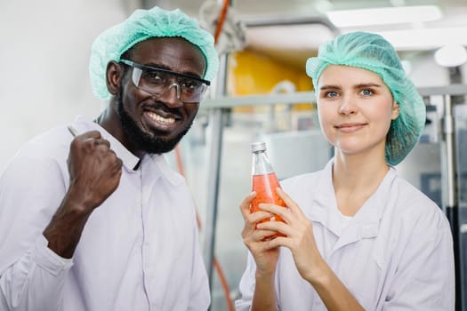 portrait of mix race worker in food and drink factory happy worker together looking camera and smile