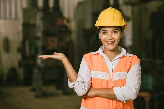 Asian woman teen worker with hand present showing copy space happy smiling face.