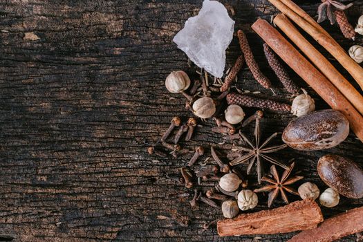 Chinese Indian Thai Dried mix herbal medicine or food ingredient or aroma extract on old wooden background with space for text.