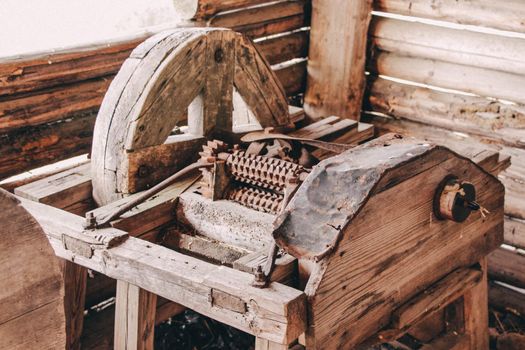 Old wooden grain thresher, authentic agricultural devices . High quality photo