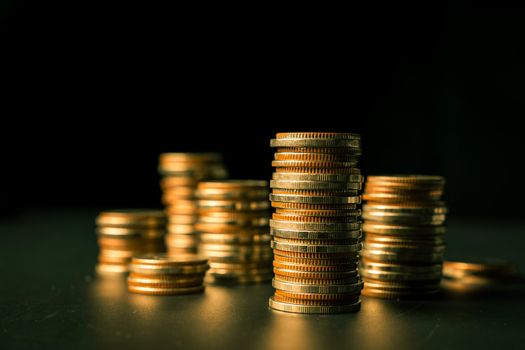 Pile of gold coins stack in finance treasury deposit bank account for saving . Concept of corporate business economy and financial growth by investment in valuable asset to gain cash revenue profit .