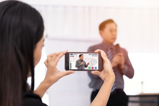 Creator people holding smartphone video recording live streaming to online lecture presentation content. Live internet broadcast business meeting teacher seminar staff training to social media channel