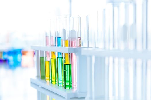 Coloful mix color chemical in test tube in chemical laboratory or Medical research lab colorful liquid for advance medical background.