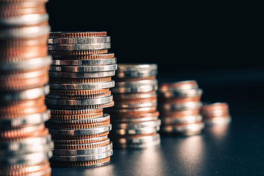 Pile of gold coins stack in finance treasury deposit bank account for saving . Concept of corporate business economy and financial growth by investment in valuable asset to gain cash revenue profit .
