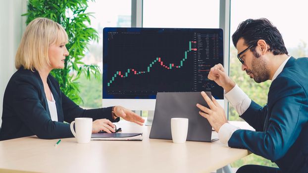 Stock market data chart analysis by ingenious computer software . Investment application display stock market chart on the computer screen and advise trading decision .