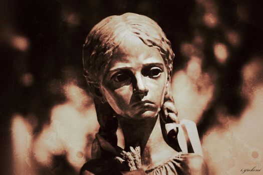 Monument to a girl with three spikelets in Kiev in grunge style. High quality photo
