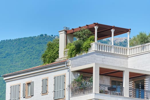 Roof patio with plants decoration in European city.