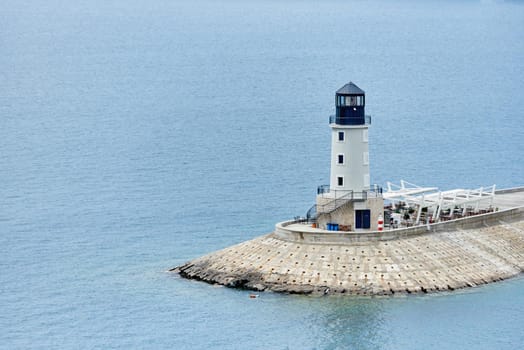New lighthouse in the sea and restaurant, tourist attraction in Montenegro.
