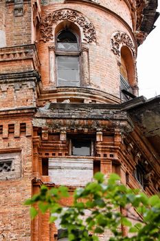 Destroyed old red brick building with broken windows in Kiev. High quality photo