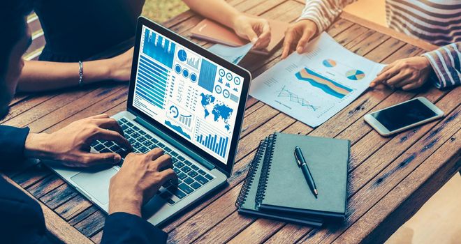 Business data dashboard analysis by ingenious computer software . Investment application display business sales and profit on the computer screen and advise marketing planning decision .