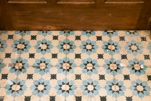 Colorful and vintage tile background on floor of abandoned house in Spain