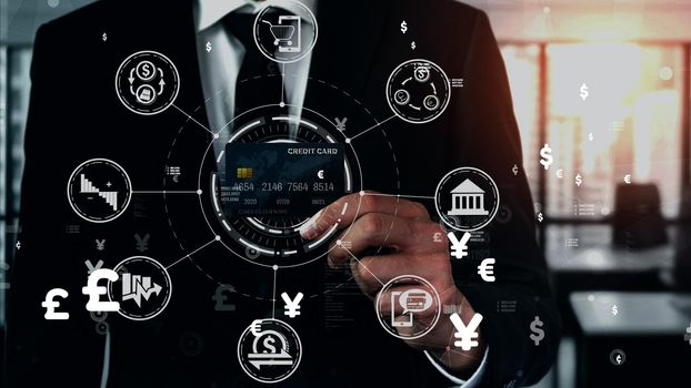 Portrait of businessman holding a credit card showing front view to the camera in close up view. Online shopping business and cashless payment conceptual.