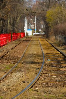 Old unused tram tracks in the city, out of focus, blurred