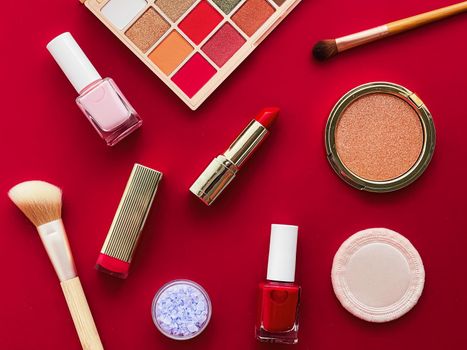 Beauty, make-up and cosmetics flatlay design with copyspace, cosmetic products and makeup tools on red background, girly and feminine style concept