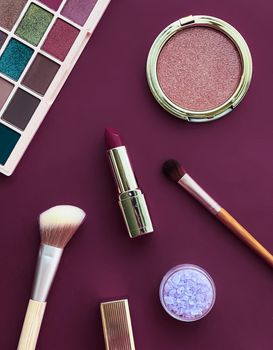 Beauty, make-up and cosmetics flatlay design with copyspace, cosmetic products and makeup tools on purple background, girly and feminine style concept