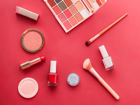 Beauty, make-up and cosmetics flatlay design with copyspace, cosmetic products and makeup tools on coral background, girly and feminine style concept