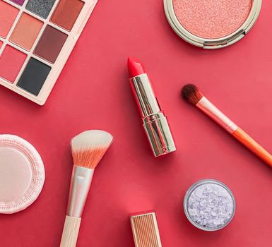 Beauty, make-up and cosmetics flatlay design with copyspace, cosmetic products and makeup tools on coral background, girly and feminine style concept