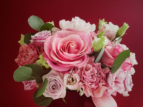 Beautiful flower box on red background, bouquet of blooming flowers as holiday gift, luxury floral design concept