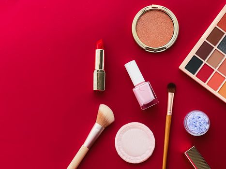 Beauty, make-up and cosmetics flatlay design with copyspace, cosmetic products and makeup tools on red background, girly and feminine style concept