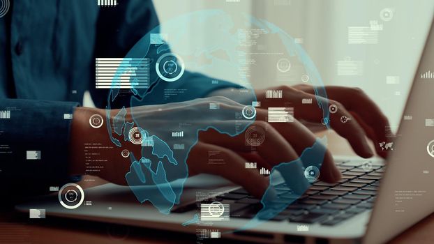 Businessman uses capable laptop computer to analyze business data analytic for marketing strategy and customer relationship management