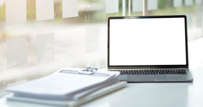 Laptop or notebook with blank screen on the floor service counter in the office.