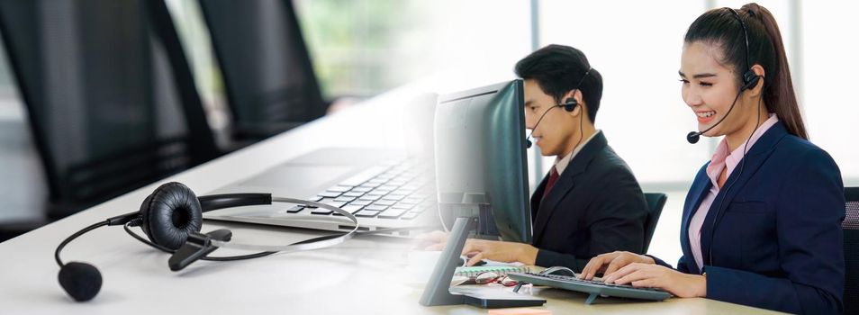 Business people wearing headset working in office in widen view to support remote customer or colleague. Call center, telemarketing, customer support agent provide service on telephone video call.