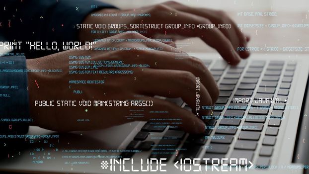 Computer programmer uses capable laptop computer to develop programming code of new software . Computer specialist working on future coding application for software programming development .