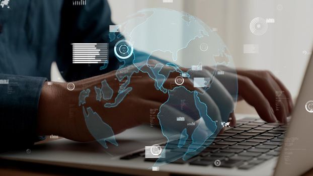 Businessman uses capable laptop computer to analyze business data analytic for marketing strategy and customer relationship management