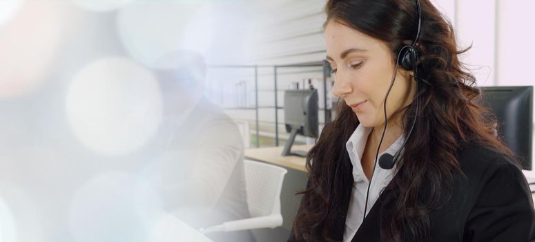 Business people wearing headset working in office to support remote customer or colleague. Call center, telemarketing, customer support agent provide service in broaden view .