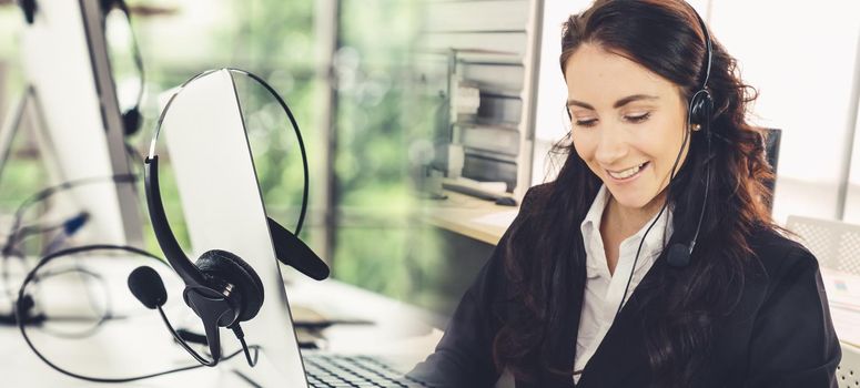 Business people wearing headset working in office to support remote customer or colleague. Call center, telemarketing, customer support agent provide service in broaden view .