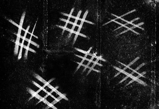 Counting marks calendar written on a black wall by white chalk. Handmade tally marks written on the wall by white chalk. Endless pandemie lockdown, longtime prison, ancient counting methods concept.