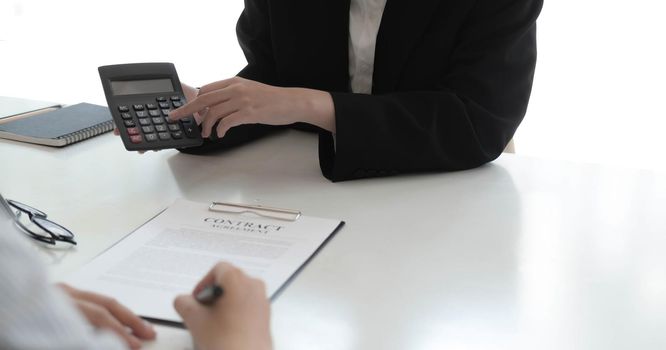 Real Estate Agent broker or House developer showing contract for buying house agreement to consultant employee.