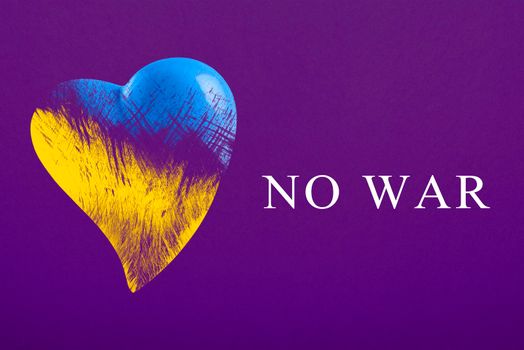 No war in Ukraine. Save Ukraine. The heart is painted in the colors of the Ukrainian flag - blue and yellow. No war text, poster on purple, violet background.