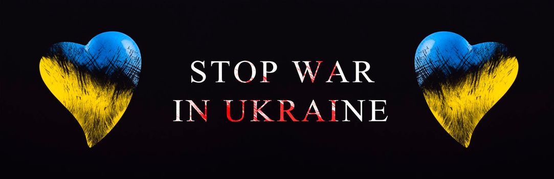 Stop war in Ukraine. Save Ukraine. The heart is painted in the colors of the Ukrainian flag - blue and yellow. Stop war text, poster on black background.